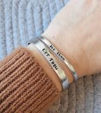 Let them cuff, Hand stamped aluminum